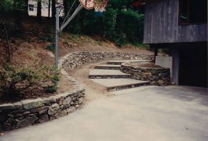 Stone walkway and stone wall by Don Nyren Masonry.