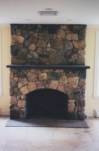Stone fireplace in Weston, Massachusetts.