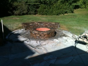 Outdoor brick fire pit by Don Nyren Masonry.